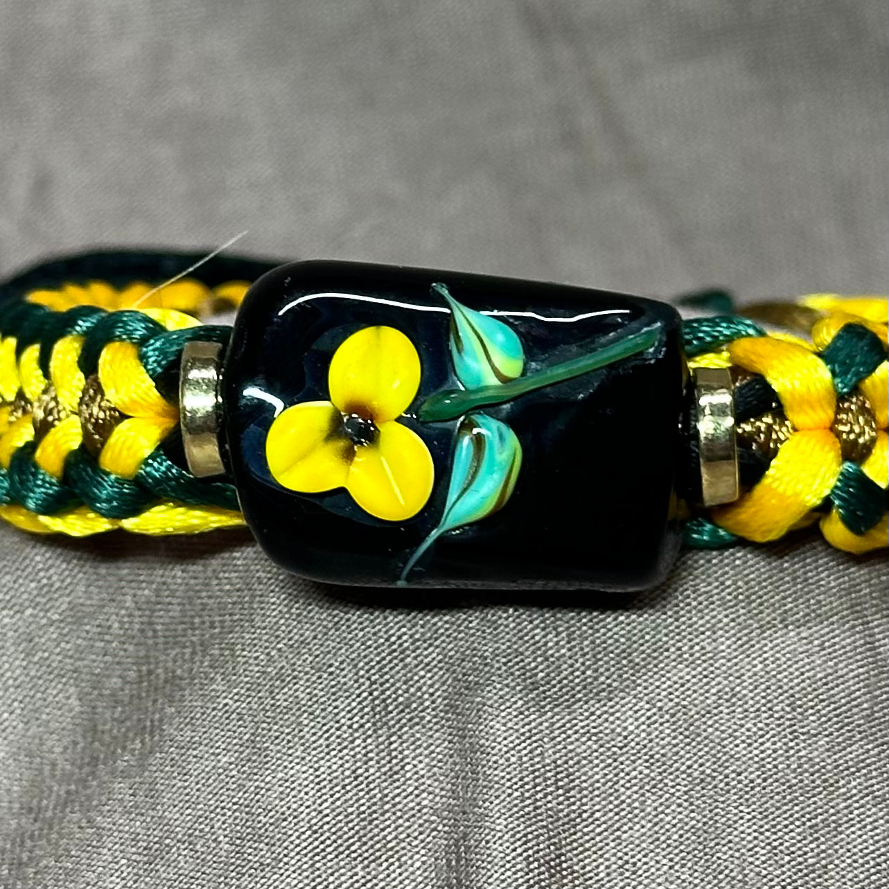Yellow flower on green, yellow & tan cord - Dr. Jen Jitsu