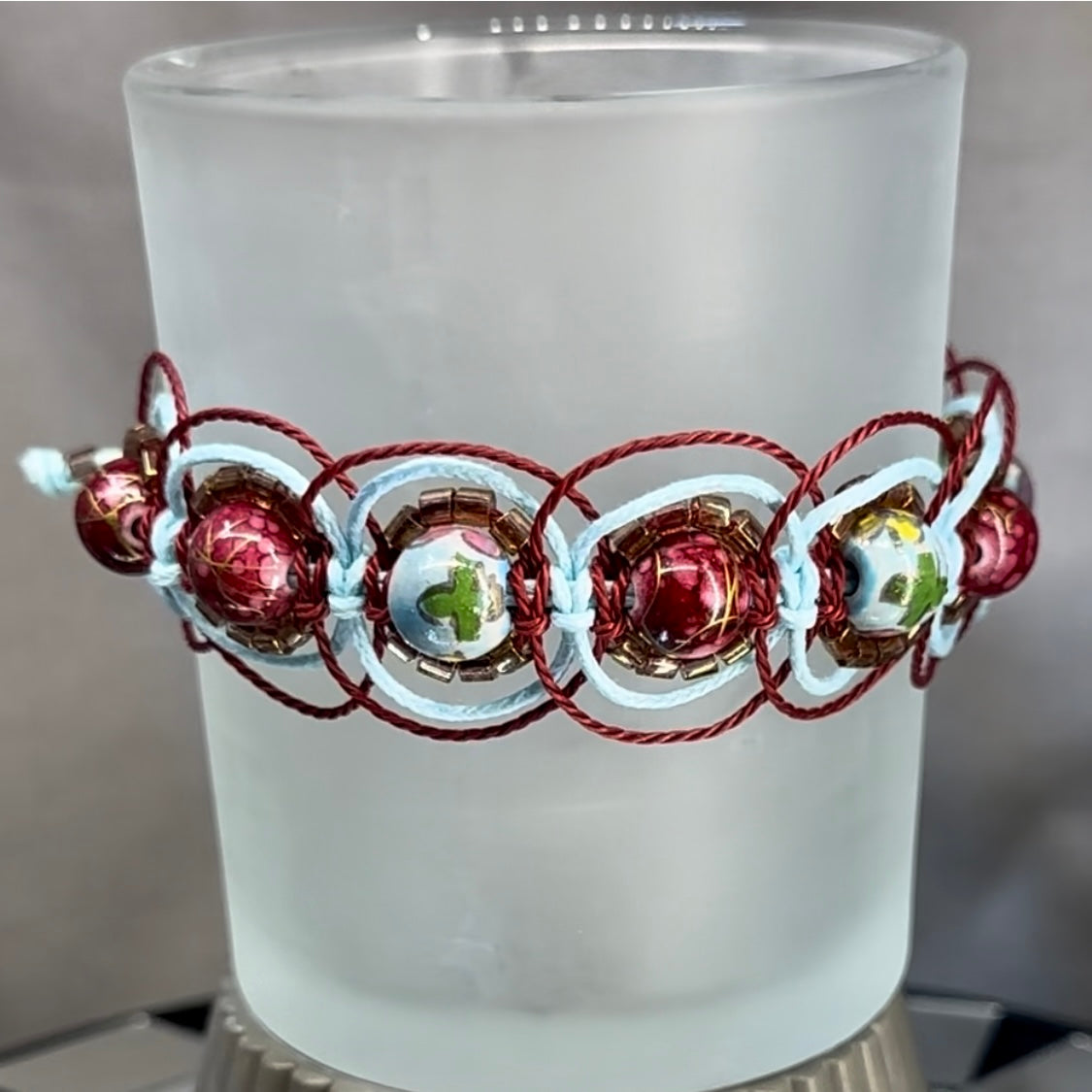 Woven bracelet featuring maroon and sky blue beads - Dr. Jen Jitsu