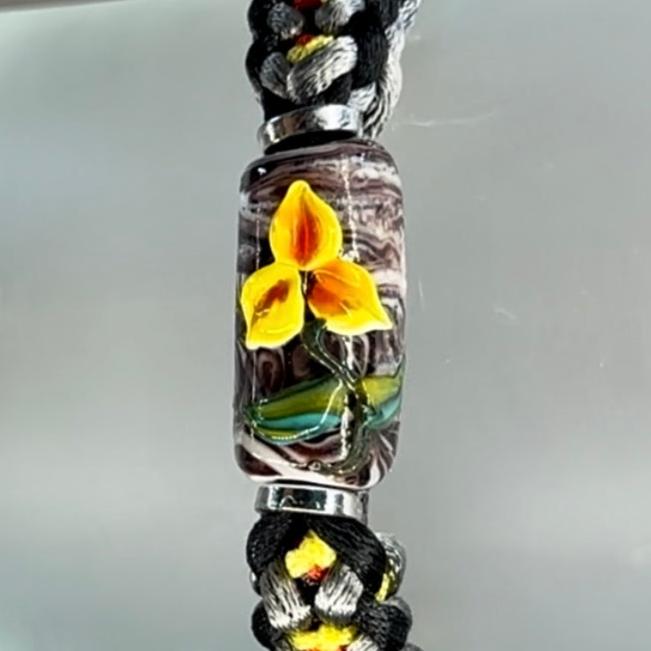 Yellow & red flower on yellow, red, gray & black cord - Dr. Jen Jitsu