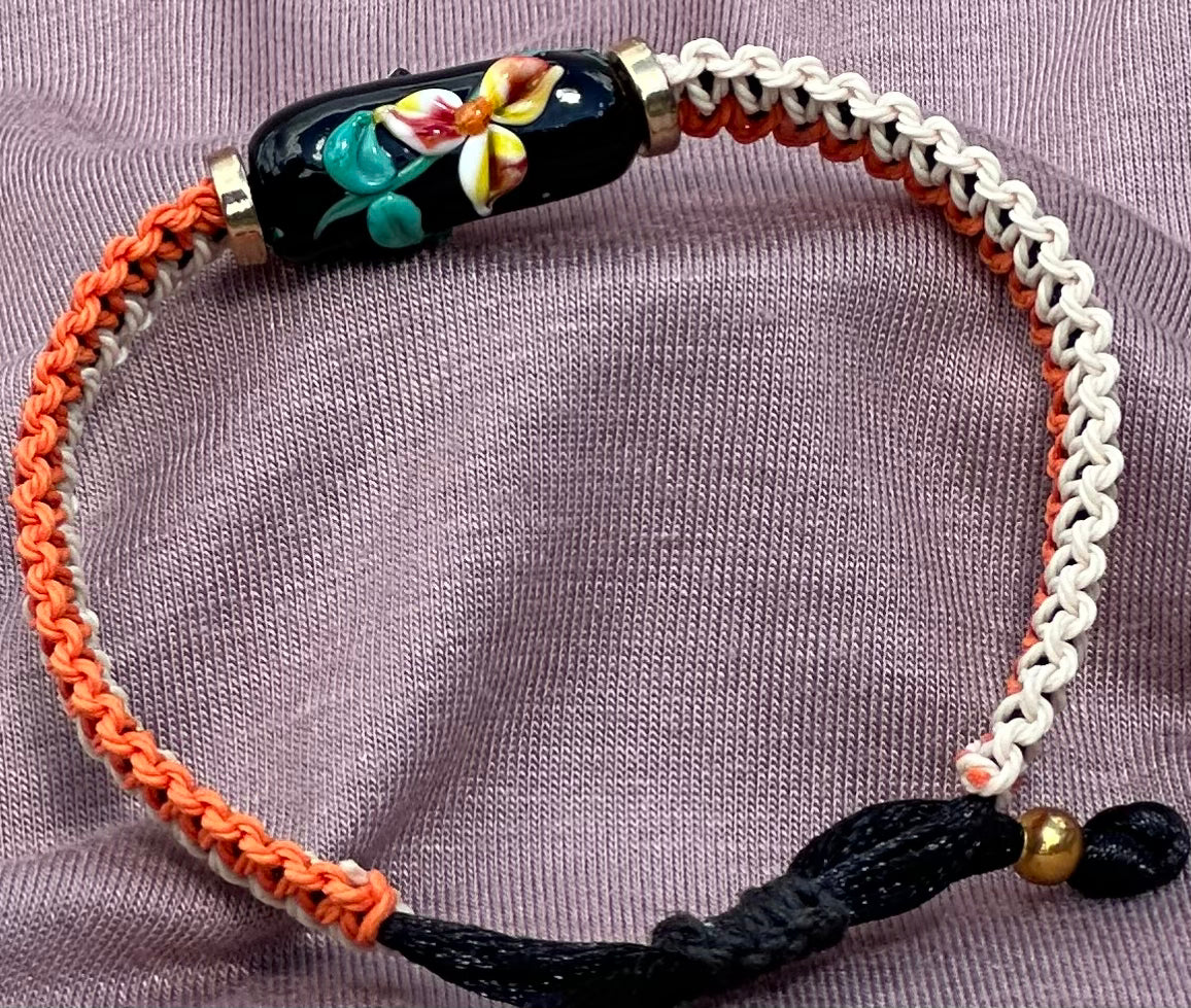 Yellow & orange flowers with a tan & orange cord - Dr. Jen Jitsu