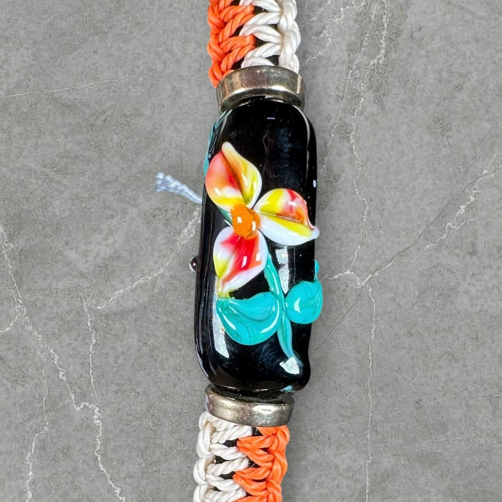 Yellow & orange flowers with a tan & orange cord