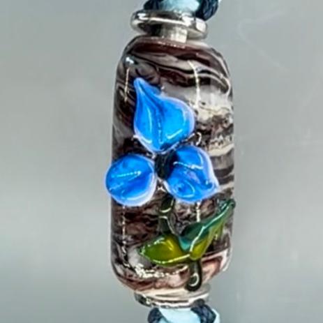 Blue flower with silver flower charms