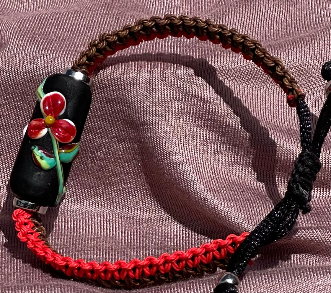 Red flowers with red & brown cord