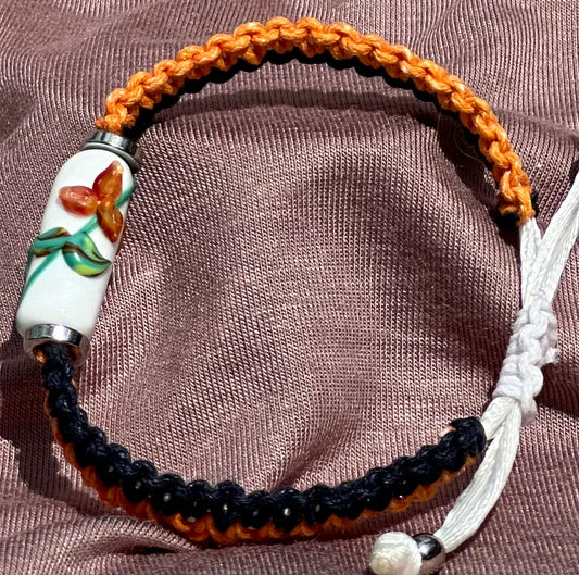 Orange flowers with orange & dark blue cord - Dr. Jen Jitsu