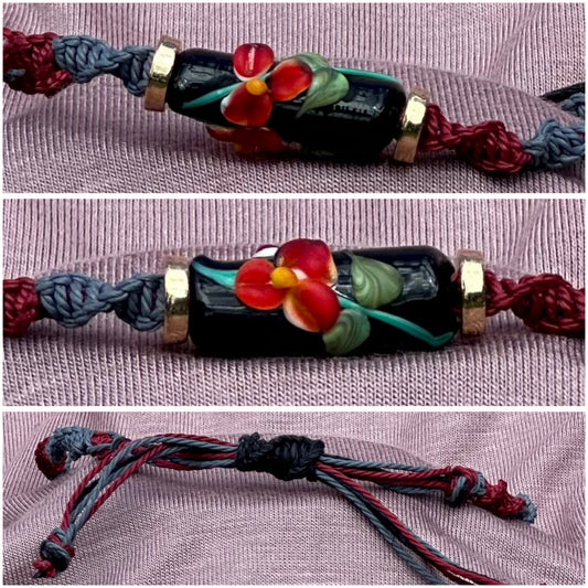 Red flower with maroon & gray cord