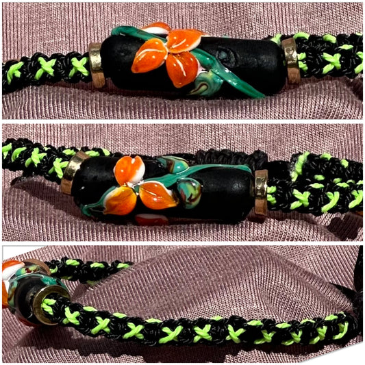 Orange flowers with a green & black cord