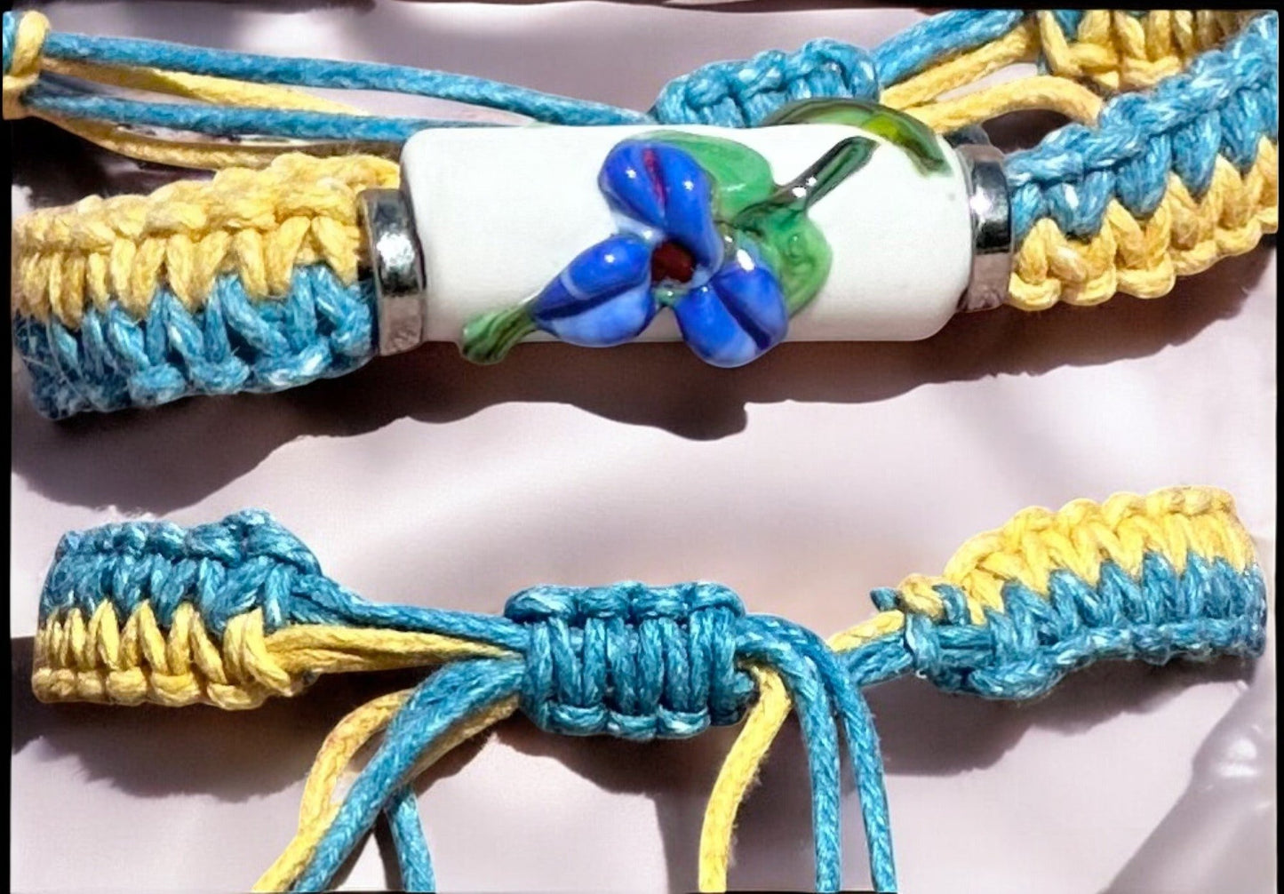 Blue flowers with a yellow & light blue cord