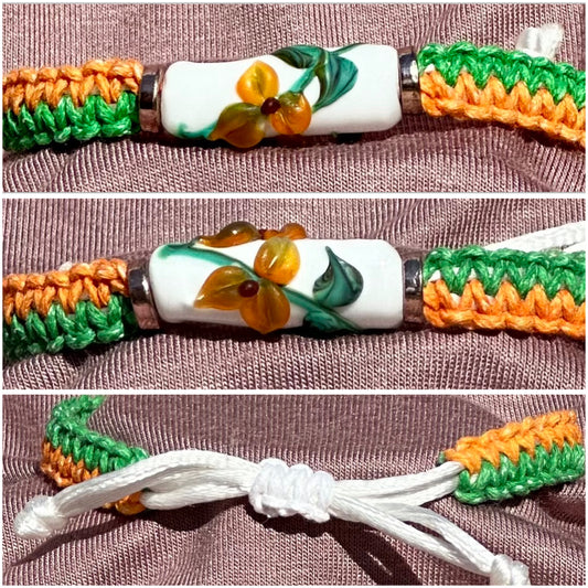 Orange flowers with a orange & green cord