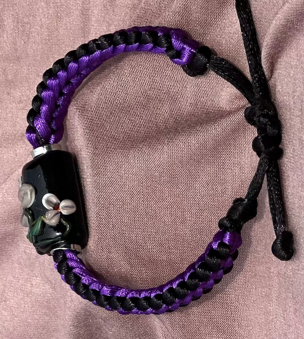 Purple flowers on purple & black cord