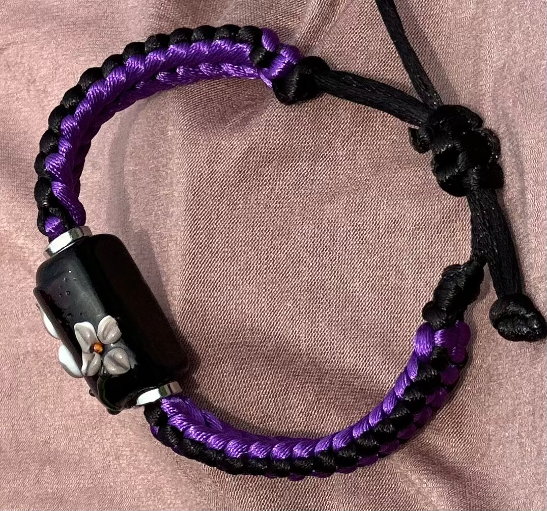 Purple flowers on purple & black cord