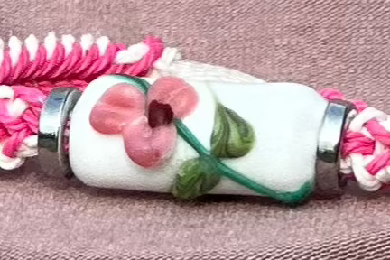 Pink flowers with a pink & white cord - Dr. Jen Jitsu