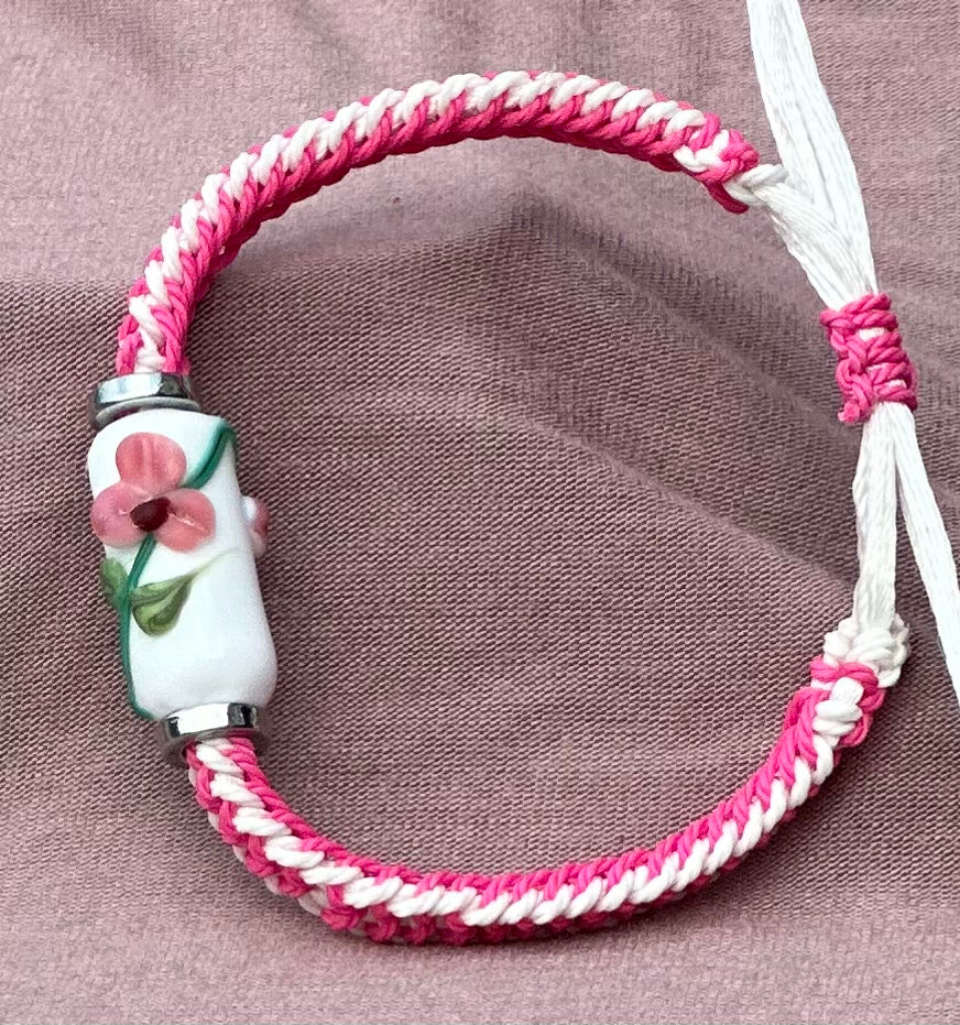 Pink flowers with a pink & white cord