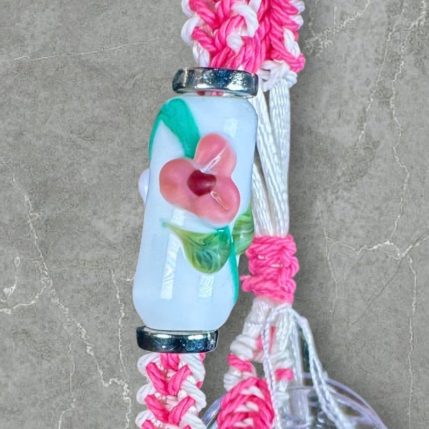 Pink flowers with a pink & white cord