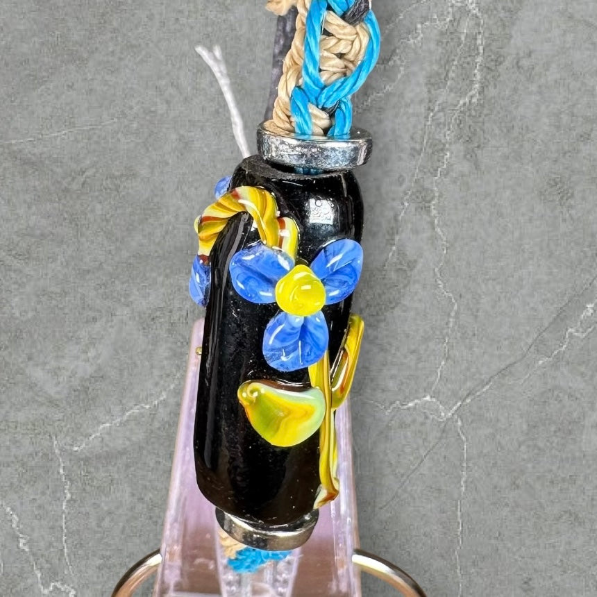 Blue flowers with a light brown & blue cord