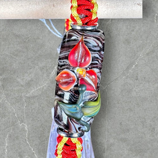 Red flowers with a red & yellow cord
