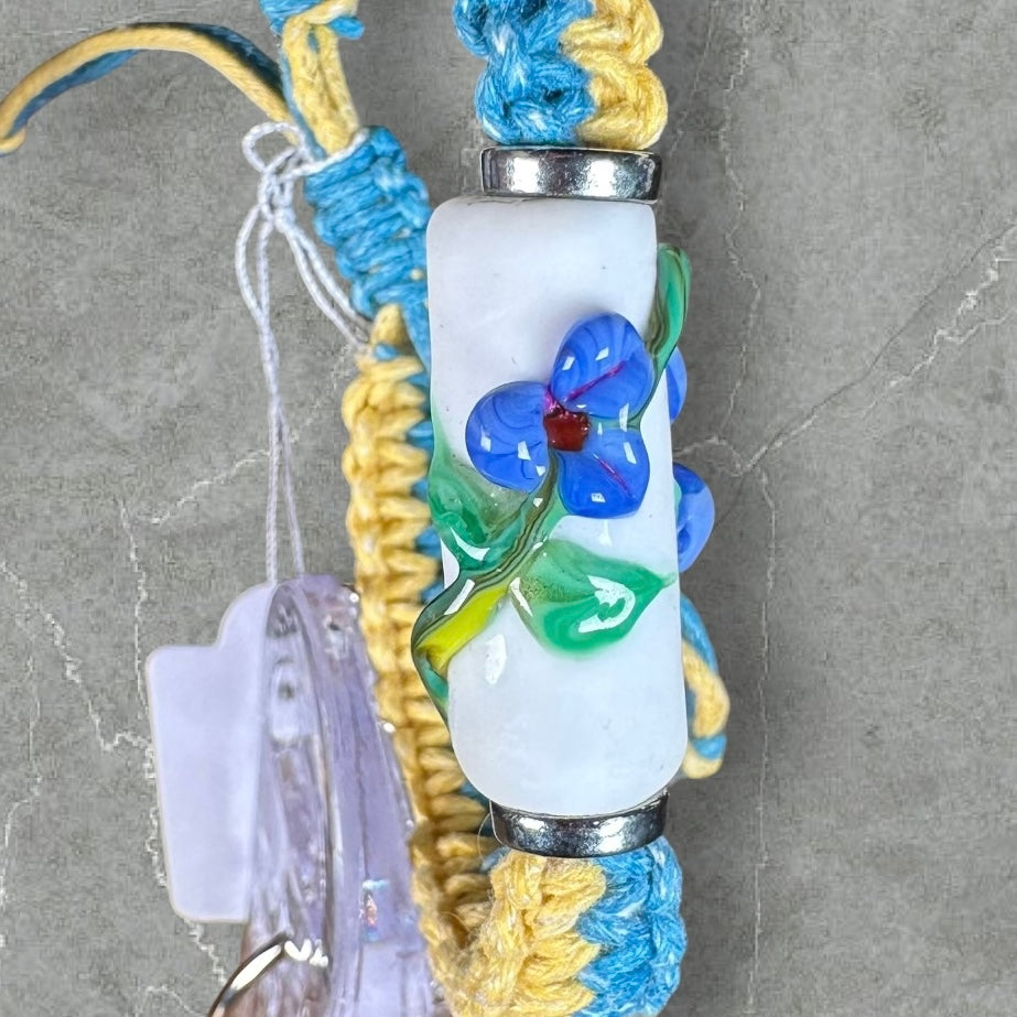 Blue flowers with a yellow & light blue cord