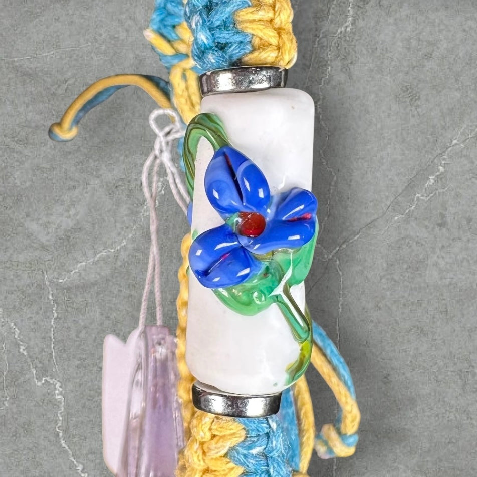 Blue flowers with a yellow & light blue cord