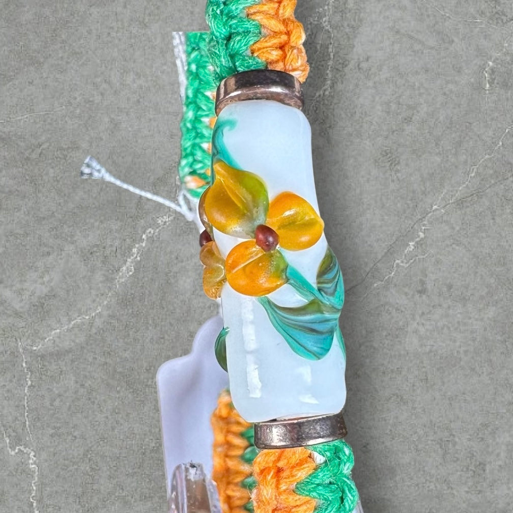 Orange flowers with a orange & green cord