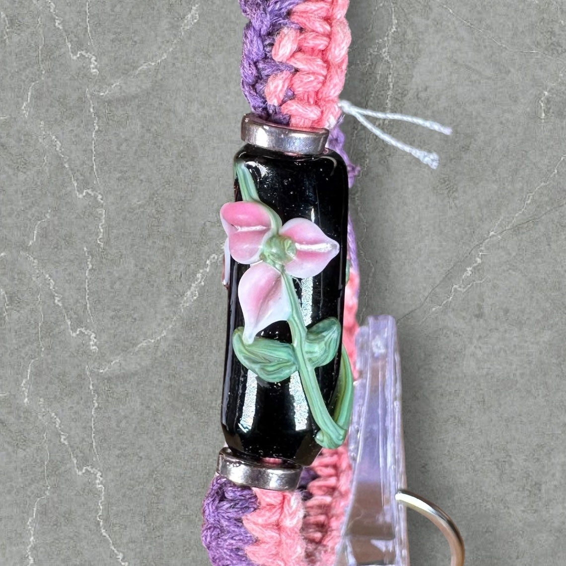 Pink flowers with pink & purple cord