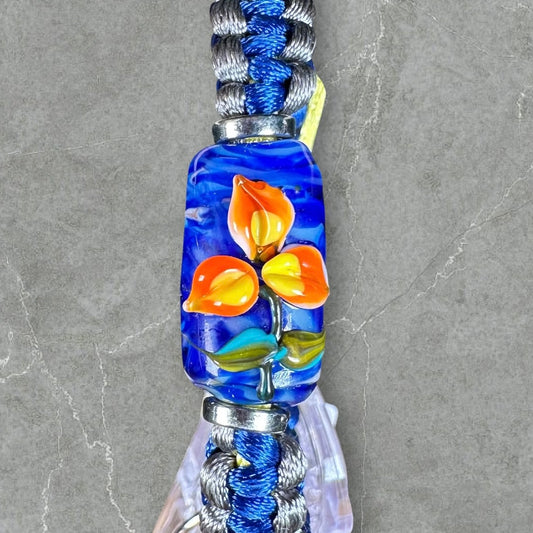 Orange & yellow flower on blue, gray & yellow cord
