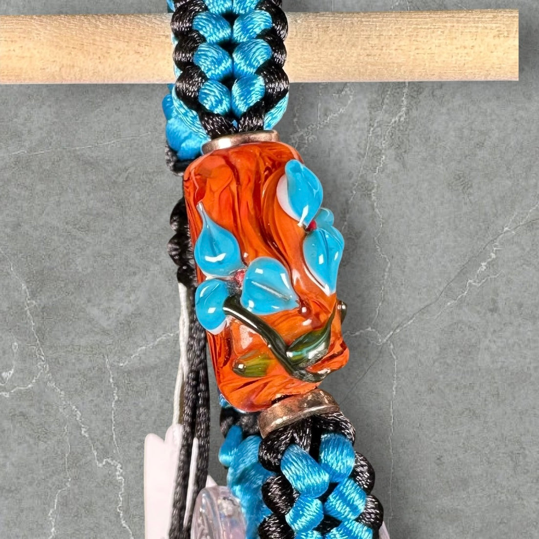 Sky blue flowers on blue & black cord