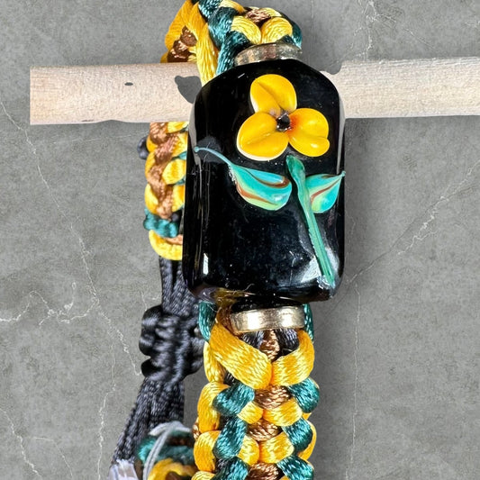 Yellow flower on green, yellow & tan cord